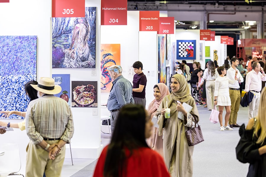 Visitors viewing artworks at World Art Dubai 2025, from the official event gallery